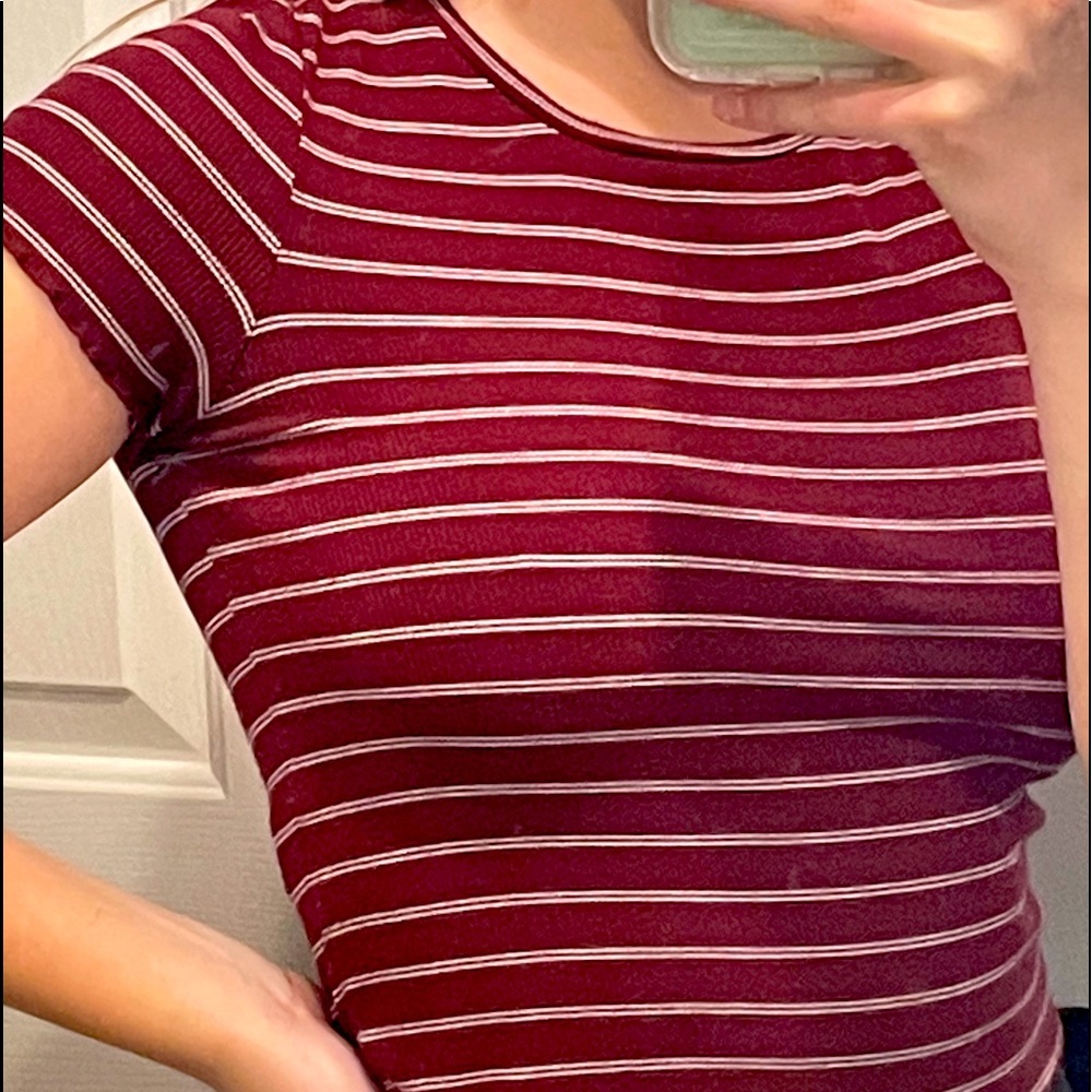 burnt orange stripped shirt with ruffle on bottom